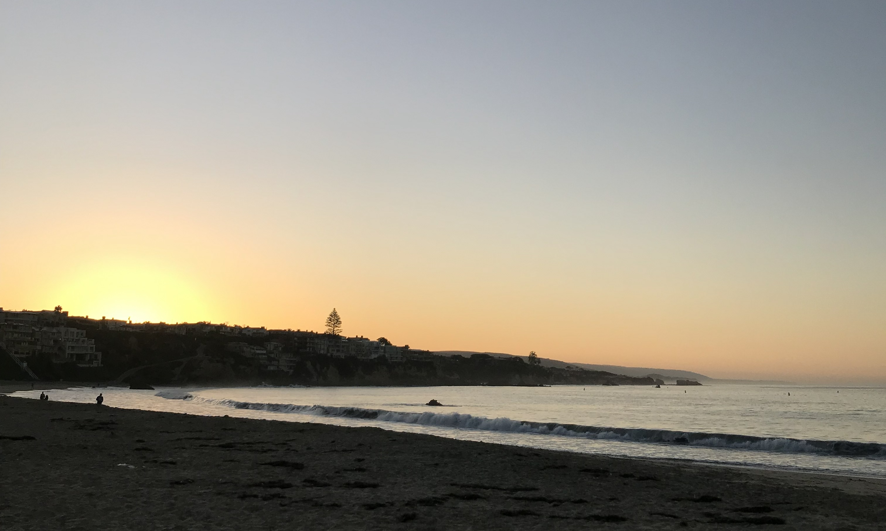 Beach and a jetty at sunset